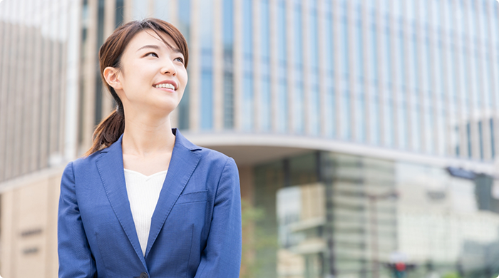 Woman in business suit walking outside