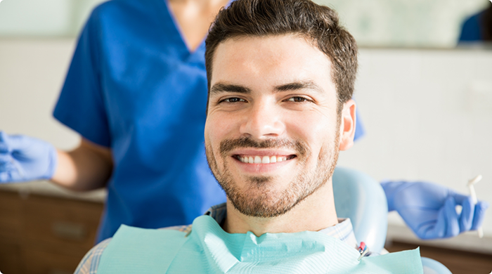 Man sitting in dental chair smiling