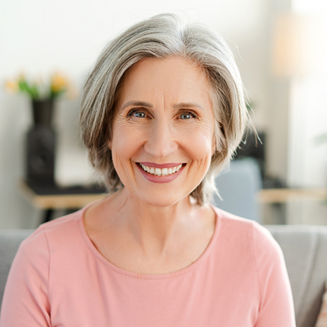 Woman in pink shirt smiling