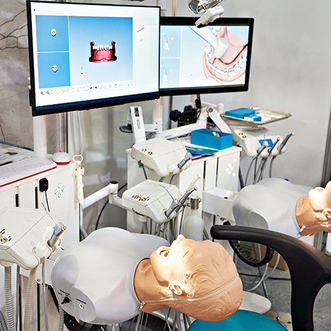 Dummies in dental chairs for hands on learning at dental school
