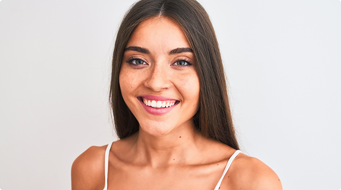 Close-up of woman in white shirt smiling