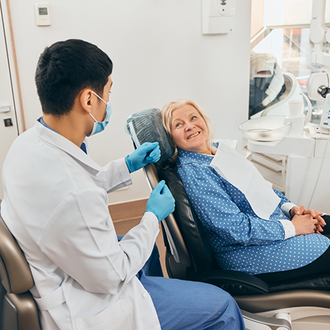 Female dental patient smiling at dentist
