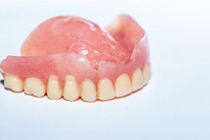 Old denture on a table